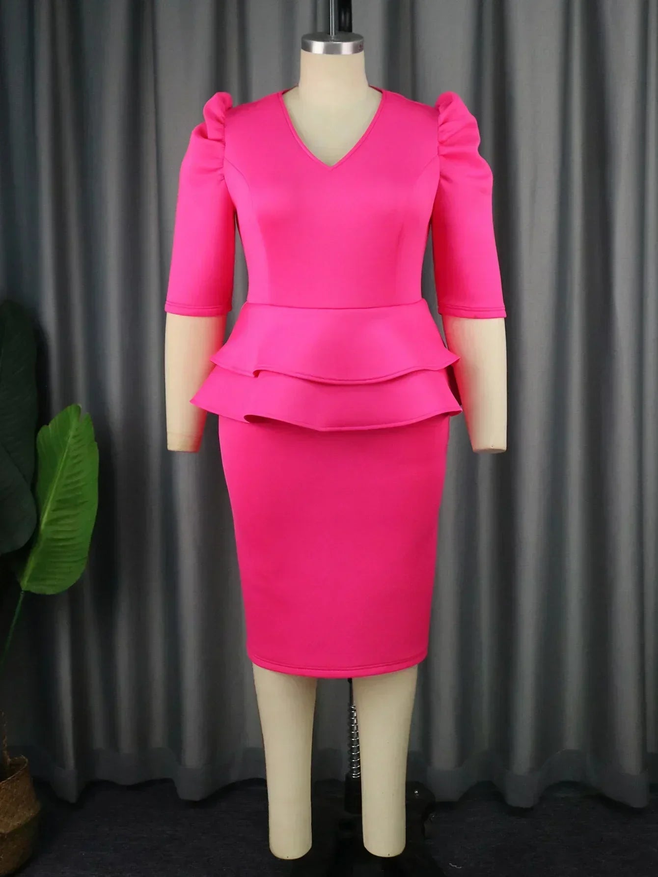 Elegant women's church dress with ruffle peplum waist, V-neck, and sheath fit, suitable for formal occasions and weddings.
