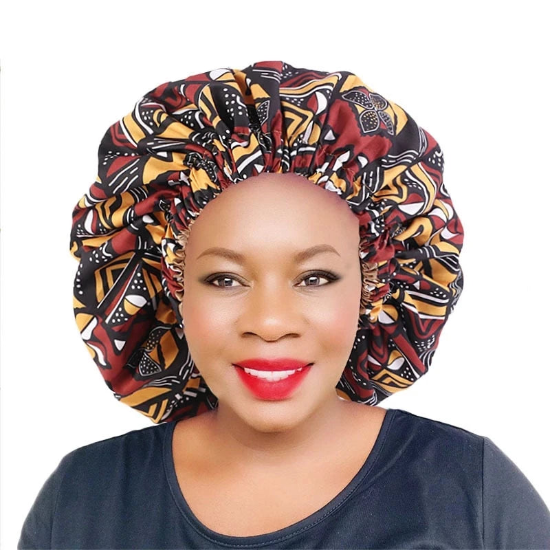 Women’s African Ankara print satin-lined sleep cap with soft, extra-large headwrap design, ideal for hair care and comfortable nightwear.