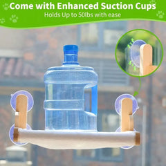 A wooden cat window perch with a soft cover attached to glass by four suction cups.