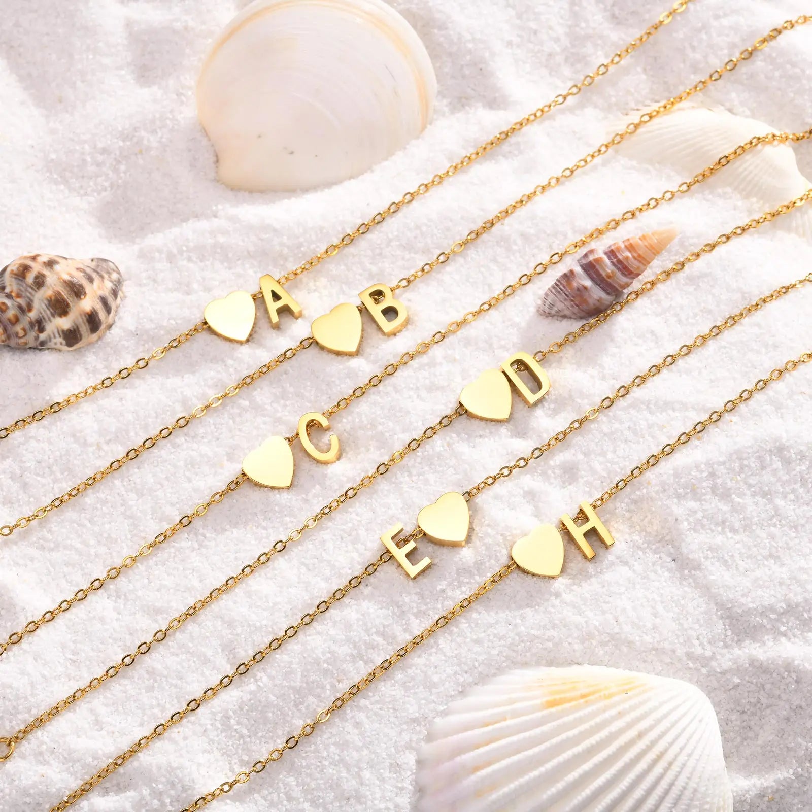 Women’s stainless steel heart initial anklet bracelet with adjustable chain and personalized name, perfect for beach jewelry.