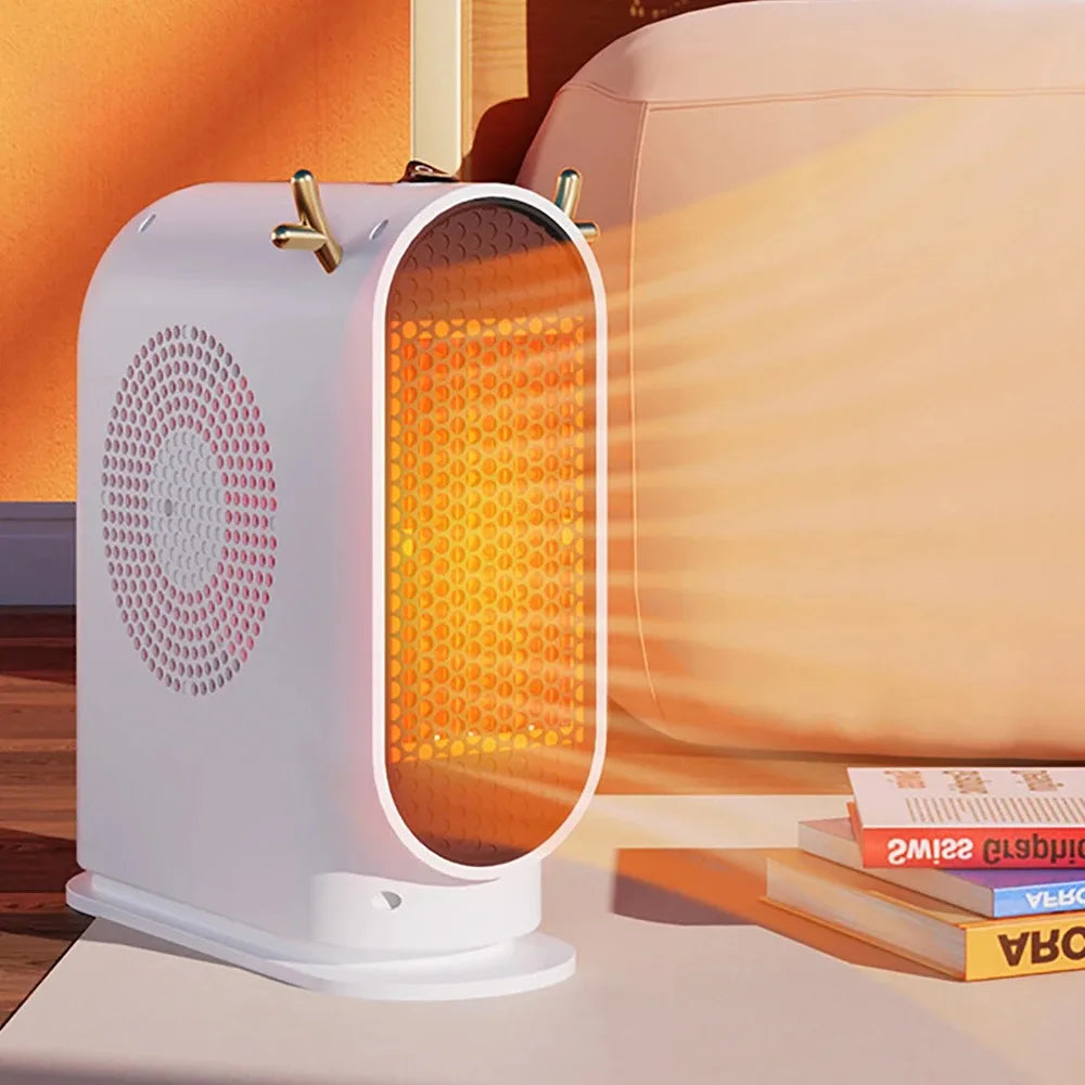 Showlu Smart General portable 500W electric desktop space heater fan on a desk, compact and efficient for heating small spaces.