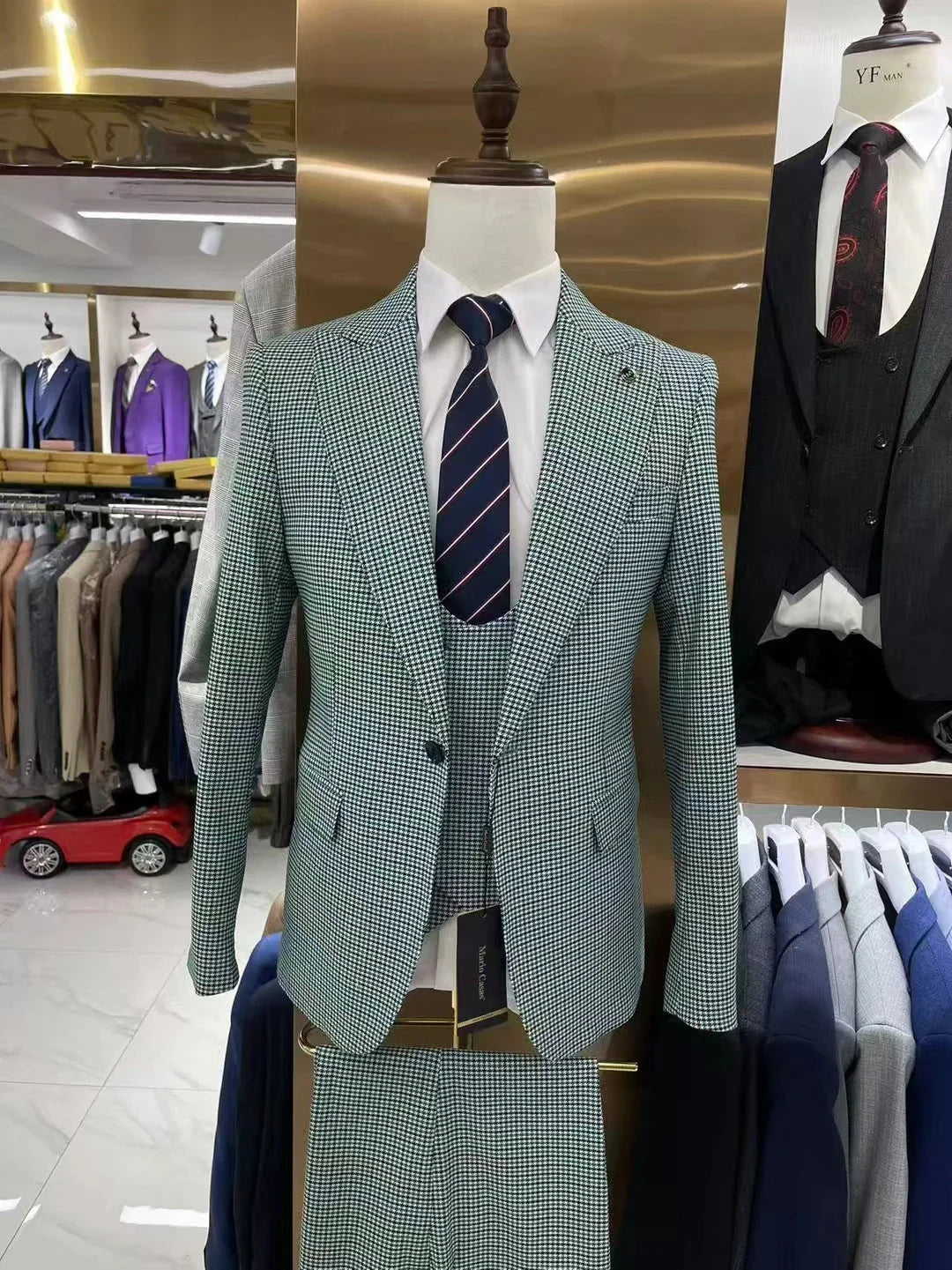 Grey plaid men's suit by SHOWLU, 3-piece slim fit tuxedo for formal occasions and weddings, styled with matching shirt and tie.