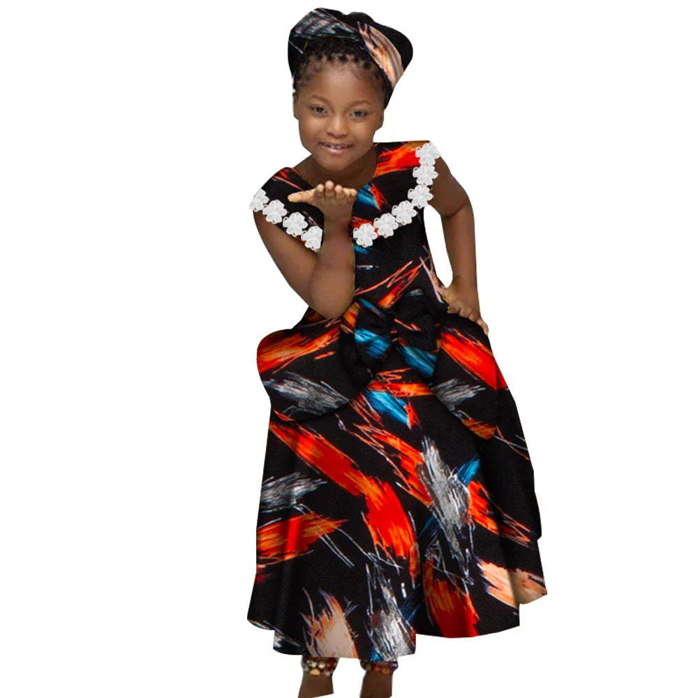 African girls Ankara print dress with kente pleated skirt and bow, vibrant traditional fabric and stylish design