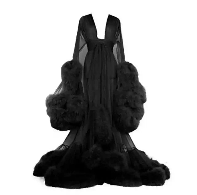 Deep V-neck tulle maternity dress with lace hollow details, long sleeves, feather accents, ideal for photo shoots by Showlu Fashion.