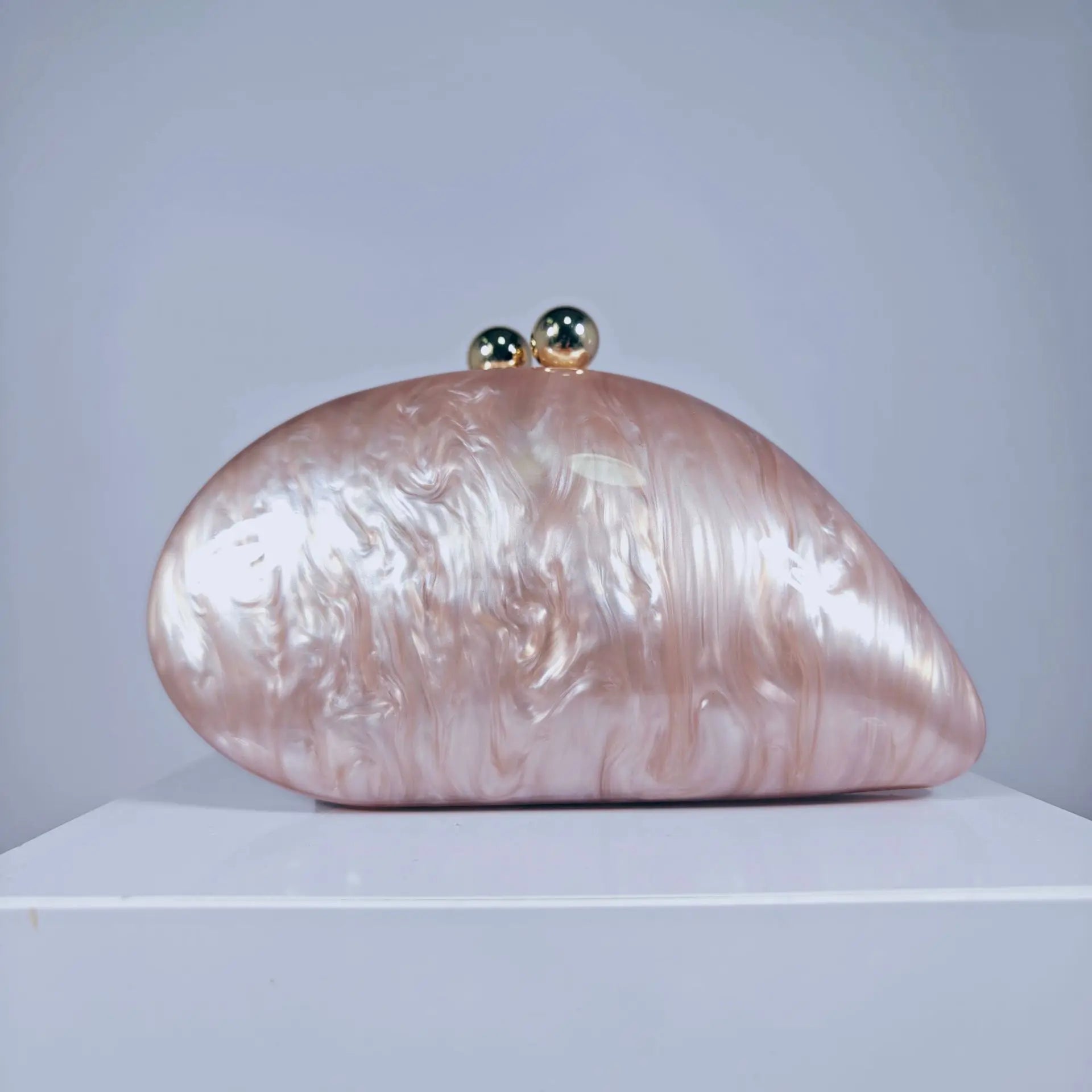 Blue acrylic shell-shaped clutch bag for women featuring pearls, designer evening purse, perfect for parties and events.
