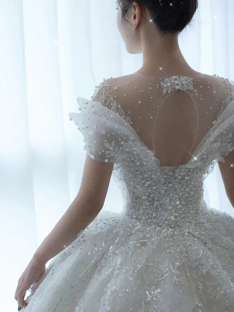 SHOWLU FASHION Crystal Beaded Tulle Ball Gown Wedding Dress with intricate beadwork and flowing tulle skirt for a bridal look.