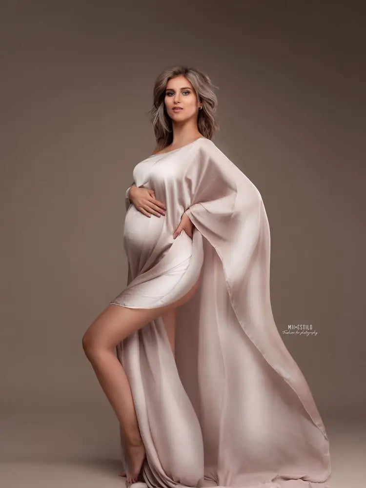 Showlu Maternity chiffon cape made of soft tulle, designed for photo shoots, draped over a pregnant woman for elegant maternity photos.