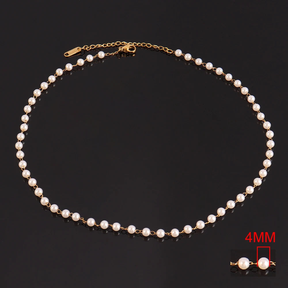 Stainless steel pearl choker necklace for women with white imitation pearls and a delicate clavicle chain design.