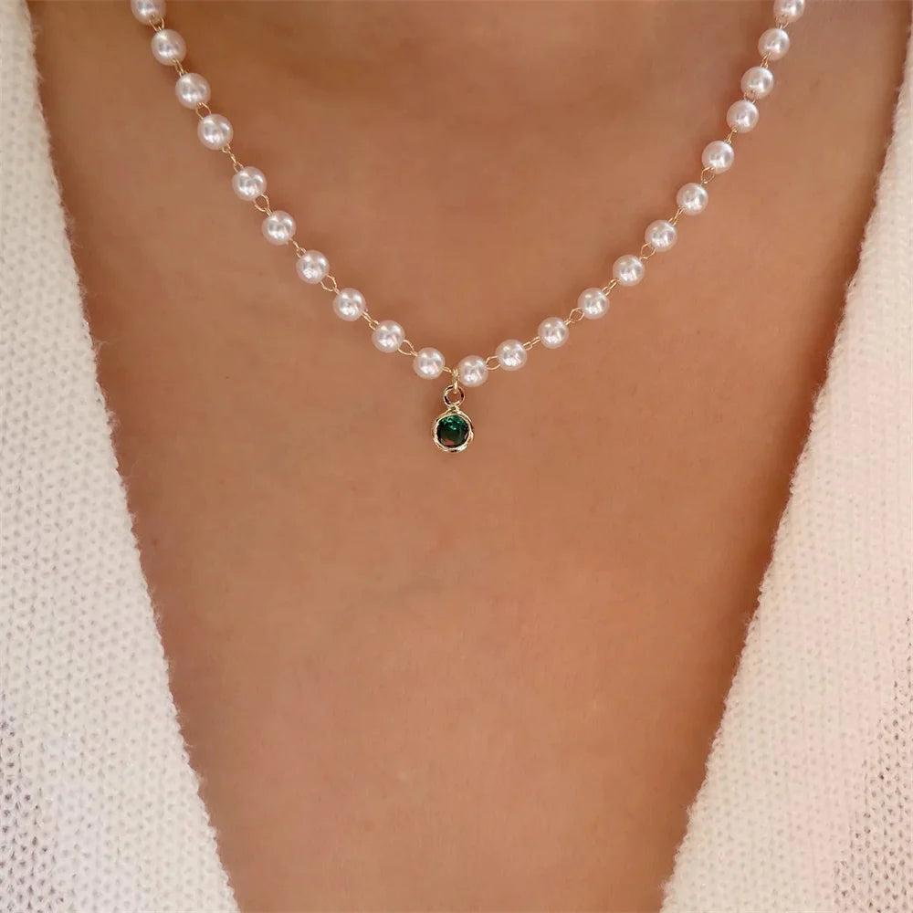 Elegant vintage pearl pendant necklace for women, featuring multi-layer gold chain choker jewelry with a round pendant.