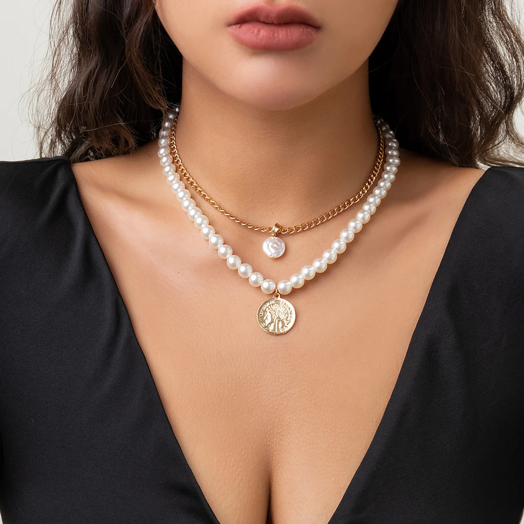 Long tassel pendant necklace with simulated pearl beads and beaded link chain, ideal for elegant wedding or fashion jewelry.