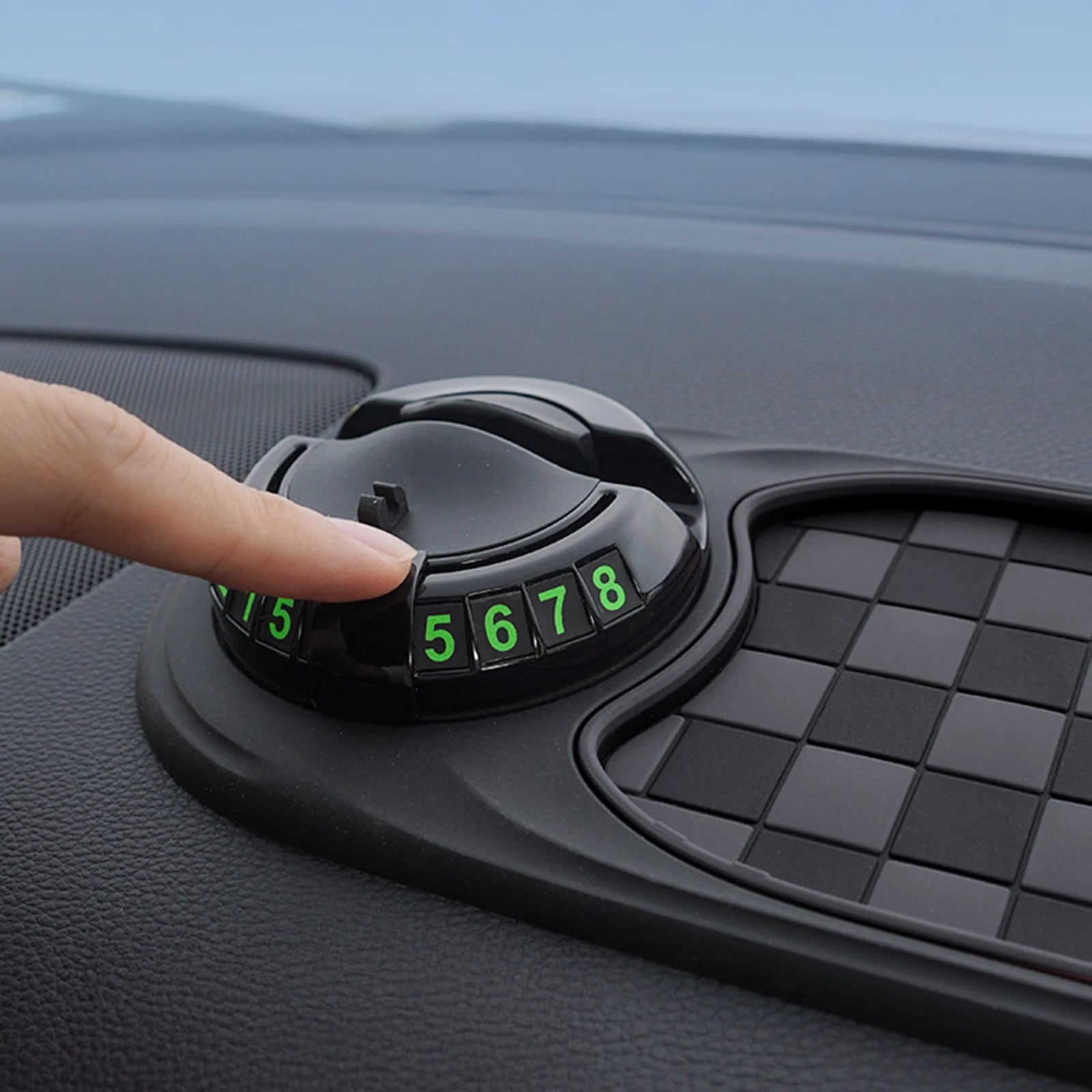 Showlu Smart General car dashboard anti-slip mat holding phone and small items on a vehicle dashboard.