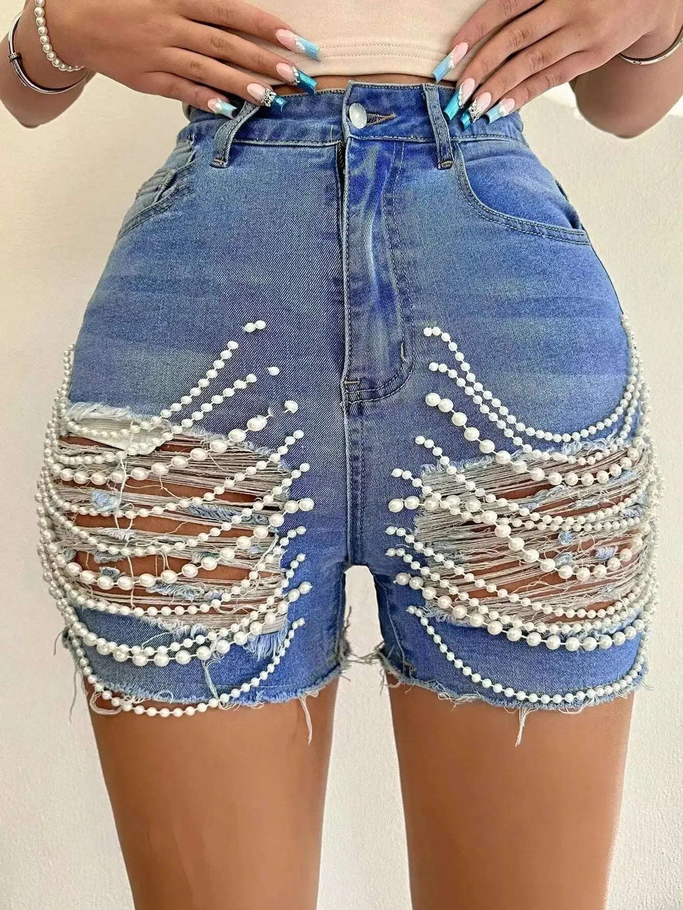 High waist ripped denim shorts for women with pearl chain detail by SHOWLU FASHION STORE, shown with distressed fabric and stylish design.