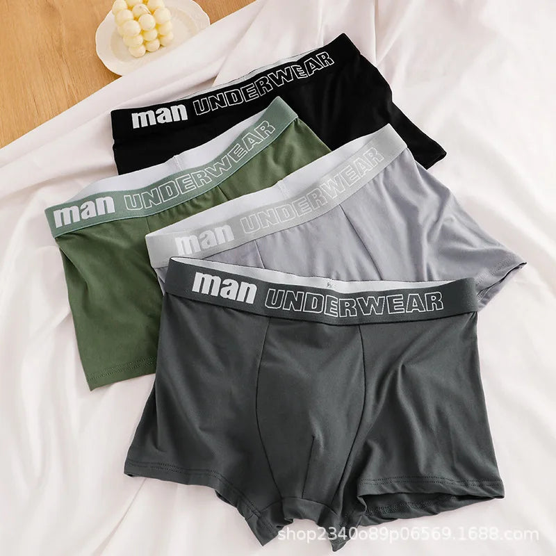 Four pairs of men's cotton boxer briefs in black, sizes L to 4XL, featuring breathable, comfortable fit for sports and everyday wear.