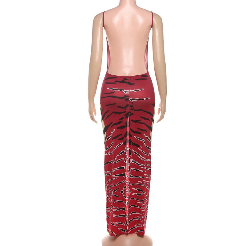 Backless printed sleeveless sling dress by Showlu Fashion, featuring a low-cut neck and fitted style for women’s summer parties.
