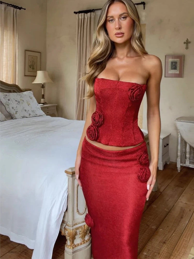 Red strapless corset top and matching maxi skirt two-piece set by Partiee Baleger, stylish fashion ensemble with fitted design.