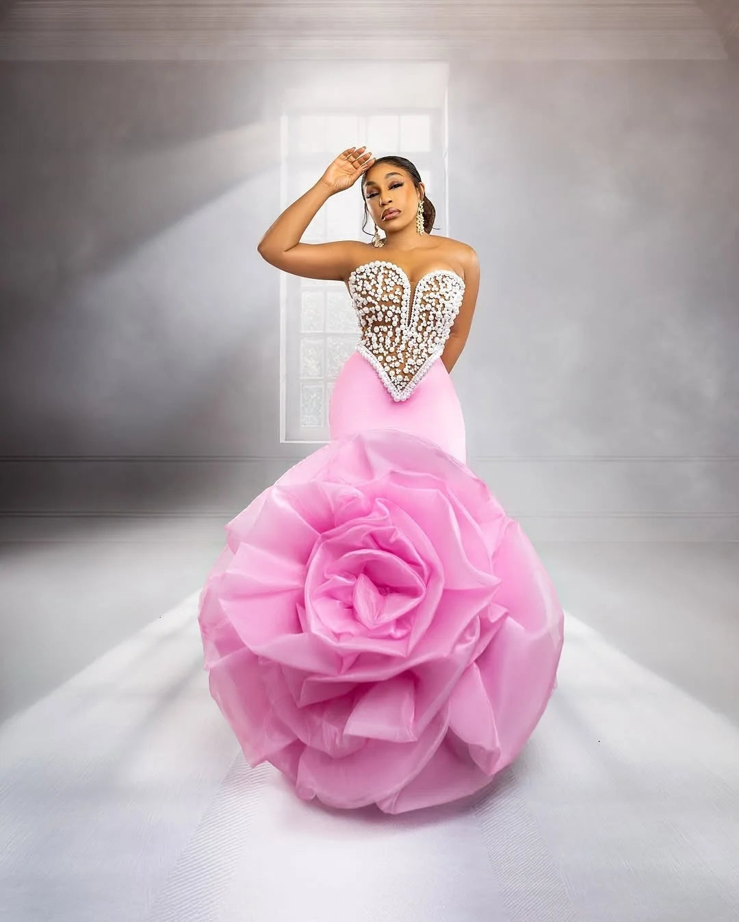 Elegant African wedding prom dress by Showlu Fashion with big floral design, luxury pearls, beads, and rose accents.