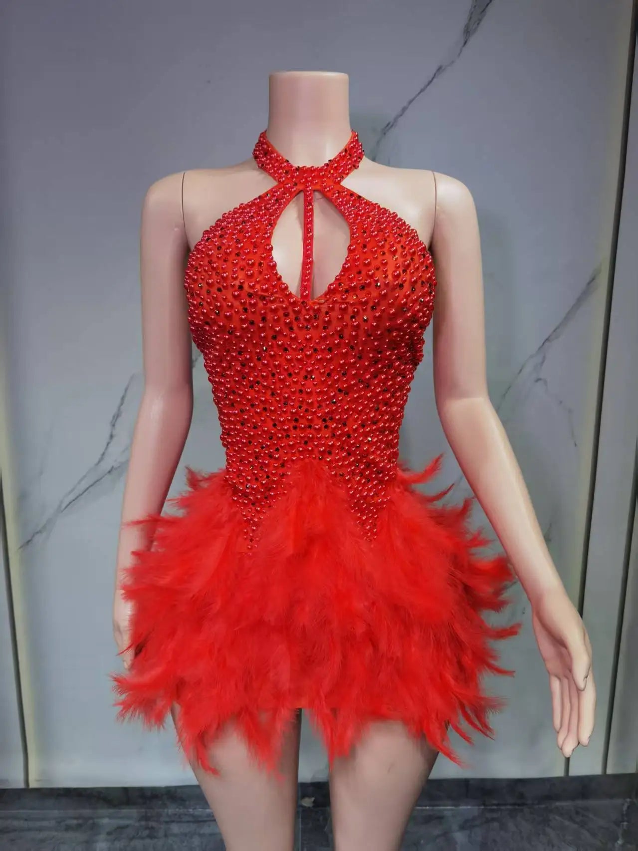 Sexy Latin dance dress with airy hollow design and feather skirt, hanging neck style from Showlu Fashion Store.