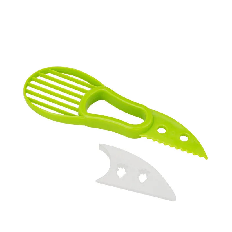 3-in-1 avocado tool from Showlu Fashion Store with a stainless steel pitter, slicer, and peeler arranged on a white background.
