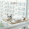 Showlu Fashion Qlfyuu Cat Window Hammock hanging in a sunny window, cozy and comfortable for cats to rest and enjoy the sunlight.