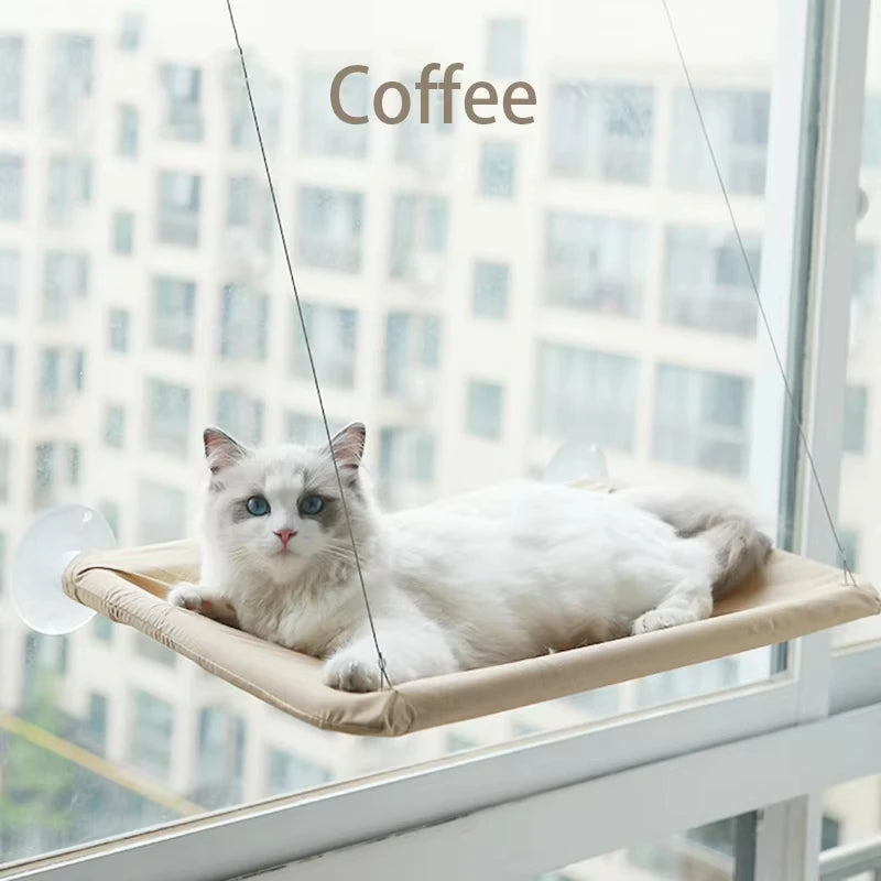 Showlu Fashion Qlfyuu Cat Window Hammock hanging in a sunny window, cozy and comfortable for cats to rest and enjoy the sunlight.