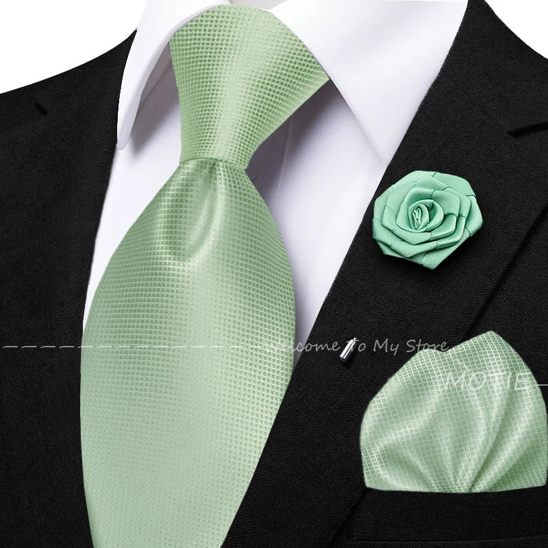 Men's solid green tie set with pocket square, flower brooch, cufflinks for wedding or daily wear, featuring collar accessories.
