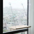 Showlu Cat Window Hanging Hammock Bed made of Oxford fabric, space-saving perch for cats to relax by the window.