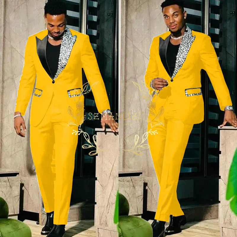 Black men's slim fit suit with single-breasted blazer and matching pants, featuring peak lapel, perfect for prom or formal events.