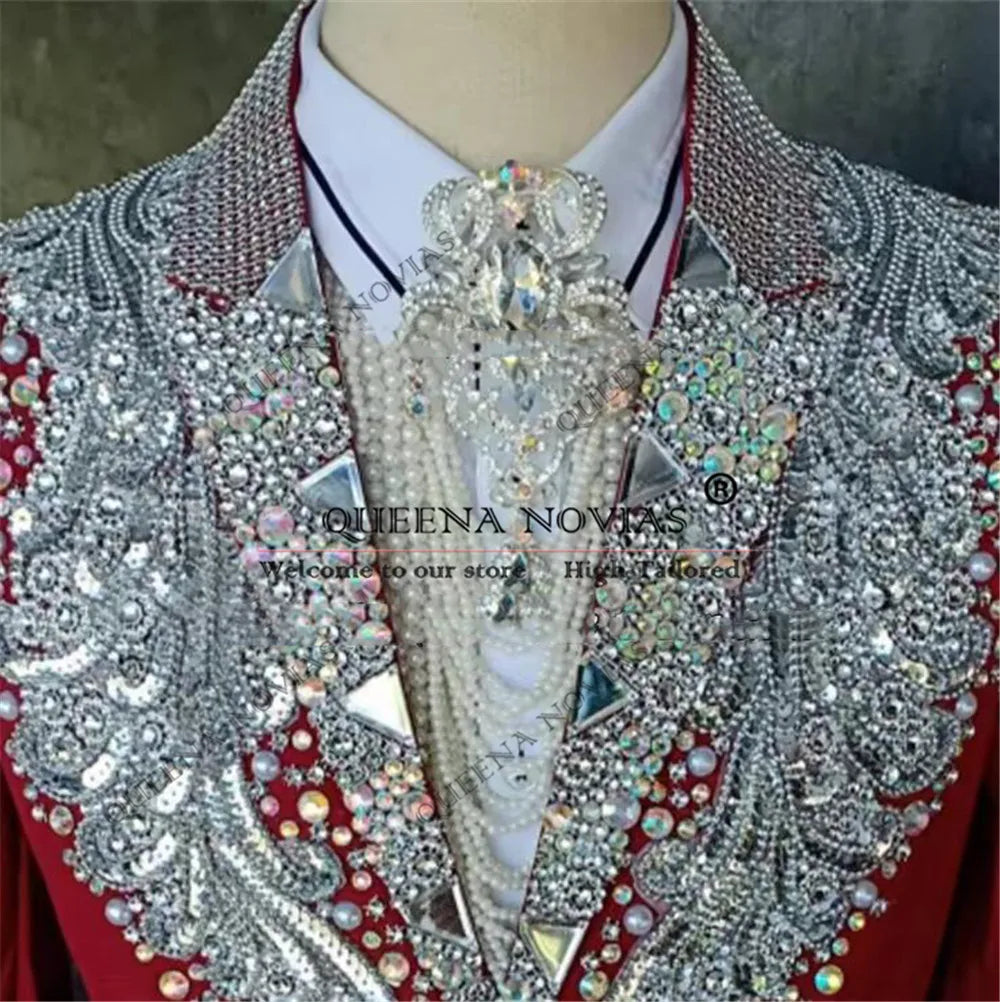 Red men's 2-piece wedding tuxedo with peaked lapel by Queena Novias, styled for formal occasions and wedding events.