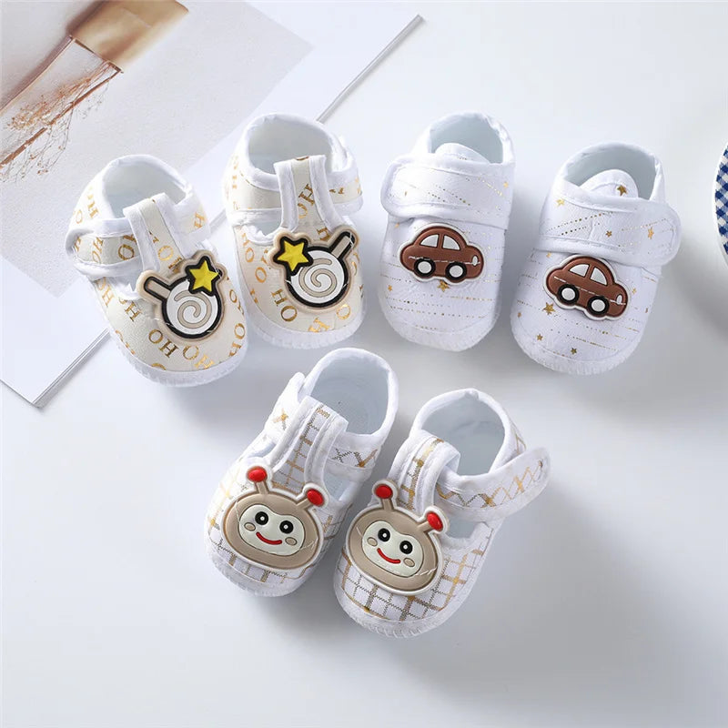 Soft cotton baby first walkers for boys and girls, showing small, comfortable newborn shoes with cute design.