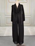 Miyake Folds women's fringe lapel coat and straight skirt two-piece set, shown in black fabric with stylish design and tailored fit.