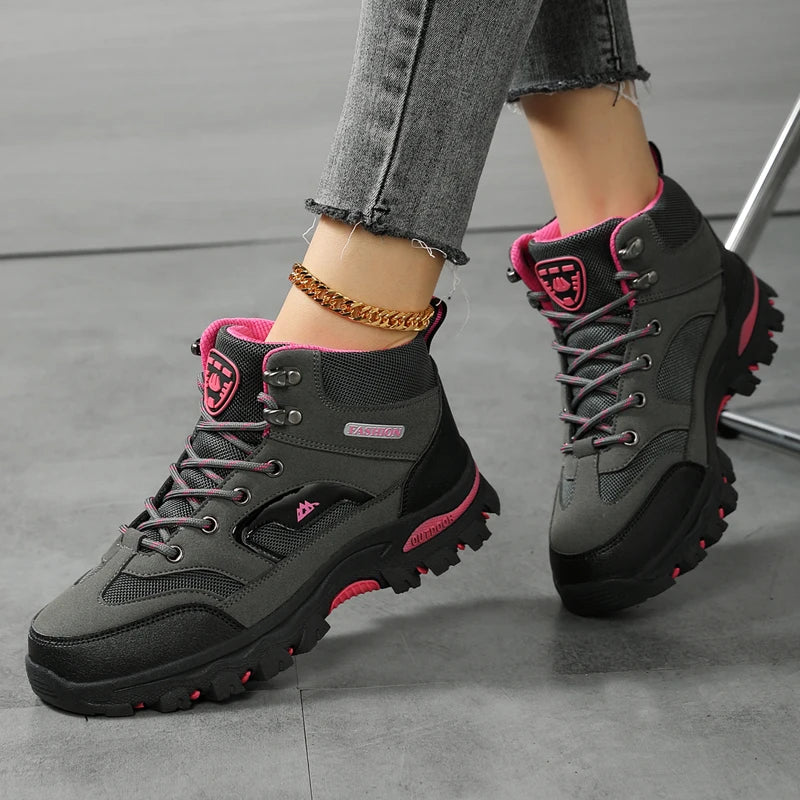 Women waterproof hiking and work boots with non-slip soles, ankle support, suitable for outdoor walking and safety activities.