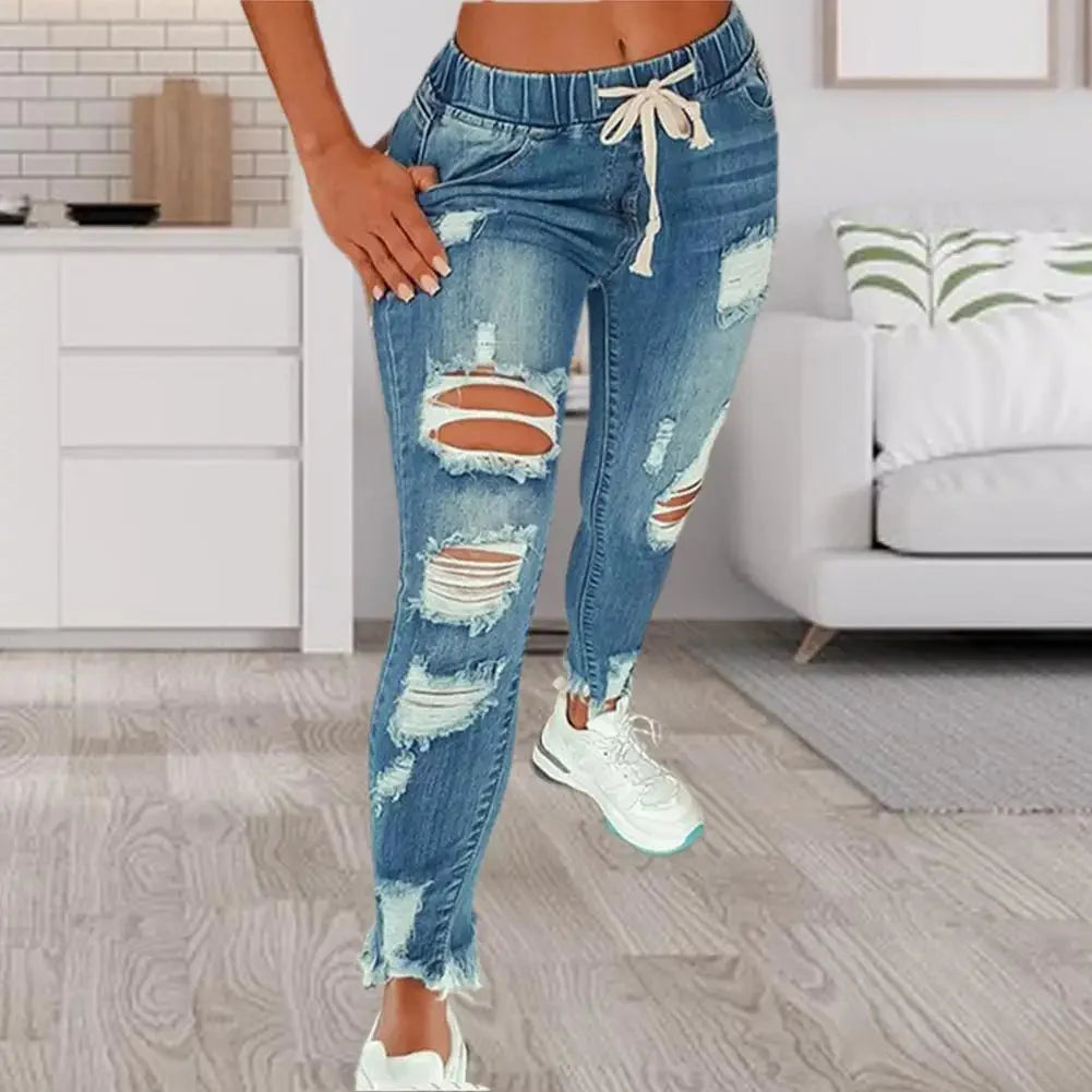 SANWOOD women's ripped hole stretchy skinny jeans with high waist, denim pants, shown on a model with a casual pose.