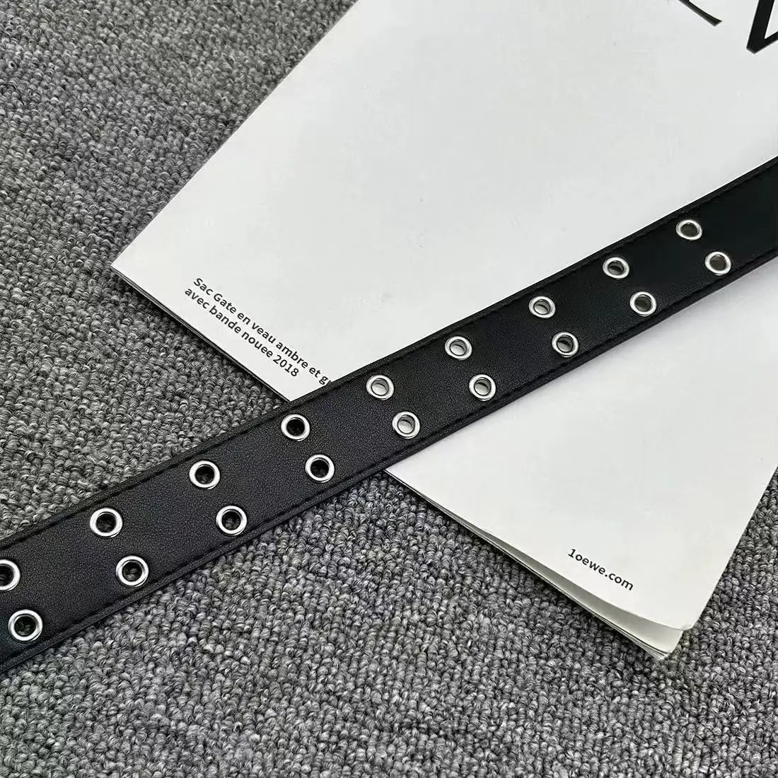 Stylish Y2K hollow PU leather punk belt for men and women, neutral waist design, plus size fashion accessory.