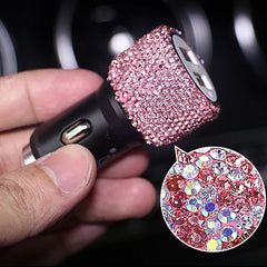 A hand holds a dual USB car charger decorated with pink rhinestones and a magnified detail view.