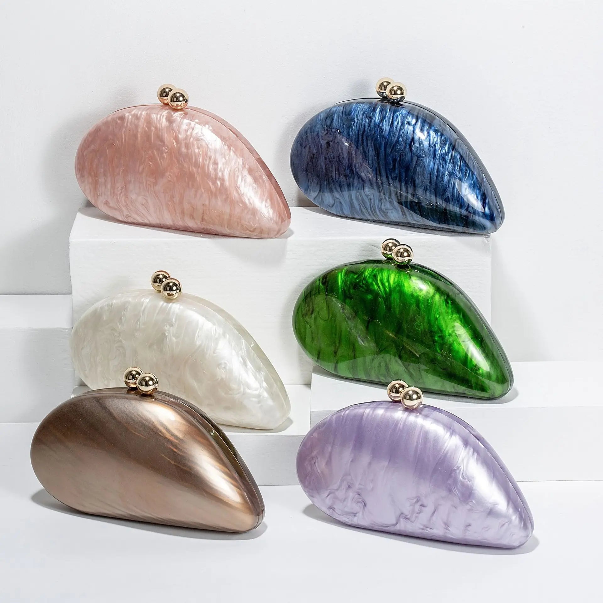 Blue acrylic shell-shaped clutch bag for women, designer evening party purse with pearl accents, perfect for events.