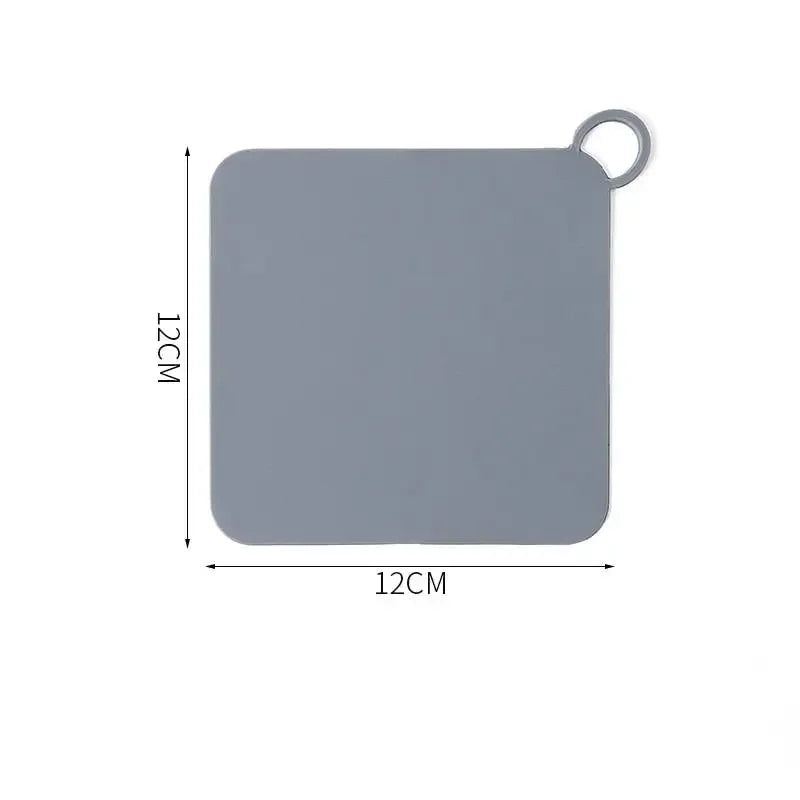 Showlu Smart General silicone drain stopper fitting into a kitchen sink to prevent water from draining.