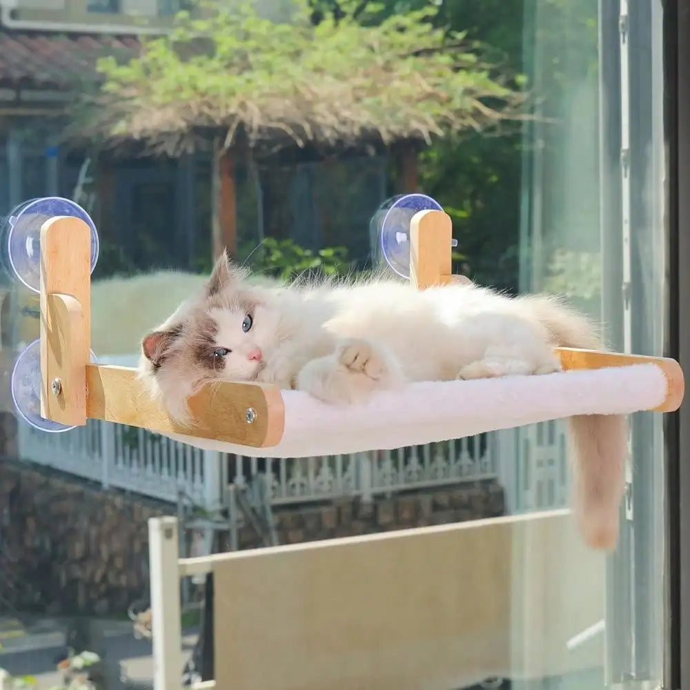 Showlu Wooden Cat Window Perch with cozy faux fur hammock bed and strong suction cups for secure attachment.