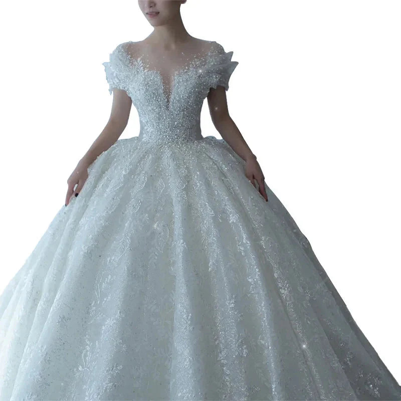 SHOWLU FASHION Crystal Beaded Tulle Ball Gown Wedding Dress with intricate beadwork and flowing tulle skirt, elegant bridal attire.