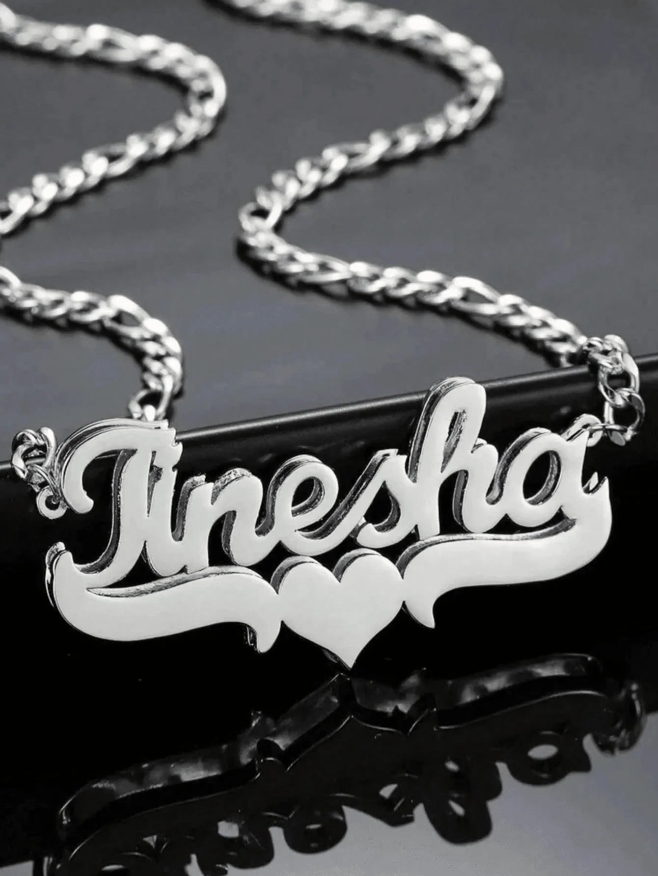 Showlu Custom Double Name Necklace with stainless steel Figaro chain, featuring two personalized names on a sleek jewelry design.