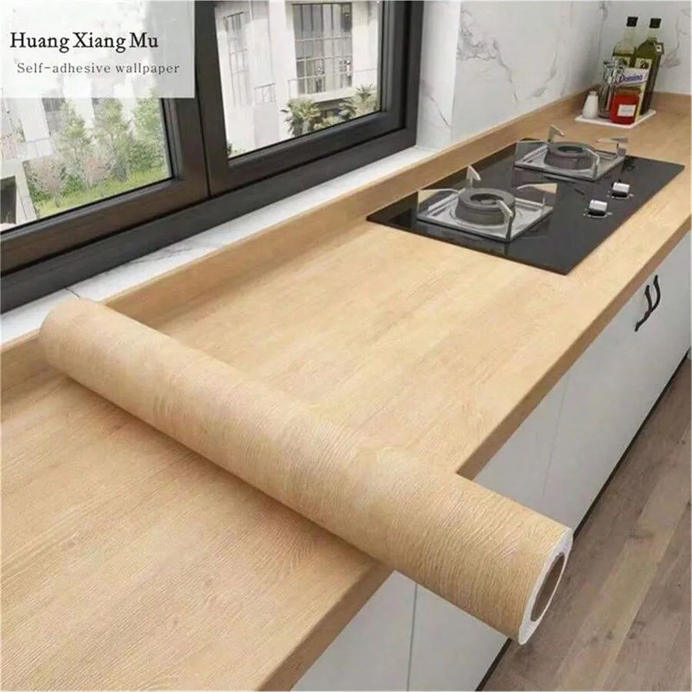 Waterproof PVC self-adhesive wallpaper with wood grain design, ideal for furniture, walls, and cabinets in home decor.