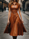 Brown PU leather midi dress by SHOWLU FASHION, featuring a belted A-line design and elegant style.