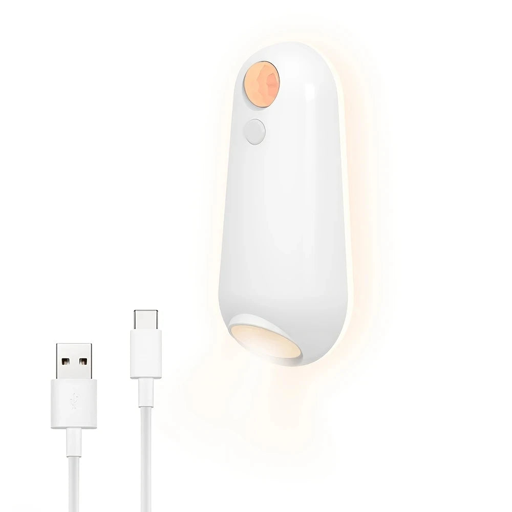 Showlu Smart Motion Sensor Mouse LED Night Light illuminating a dark room with soft, energy-efficient lighting.