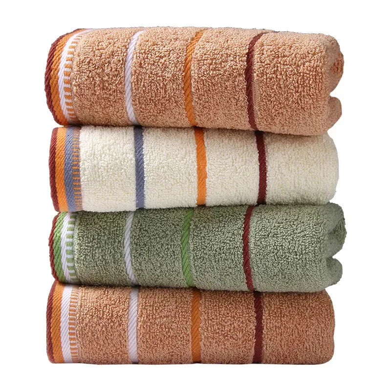SHOWLU 100% cotton hand towel, thickened solid face towel for bathroom, soft and absorbent fabric, displayed on a bathroom countertop.