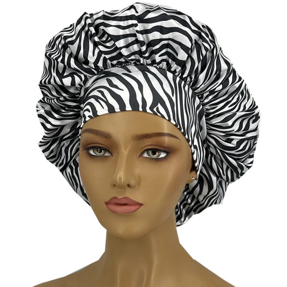 Leopard print women's sleep bonnet with wide elastic band, soft fabric, curl-enhancing, ideal for dry and textured hair.