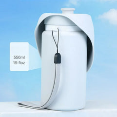 A light blue portable pet water bottle with a collapsible drinking tray and a grey wrist strap.