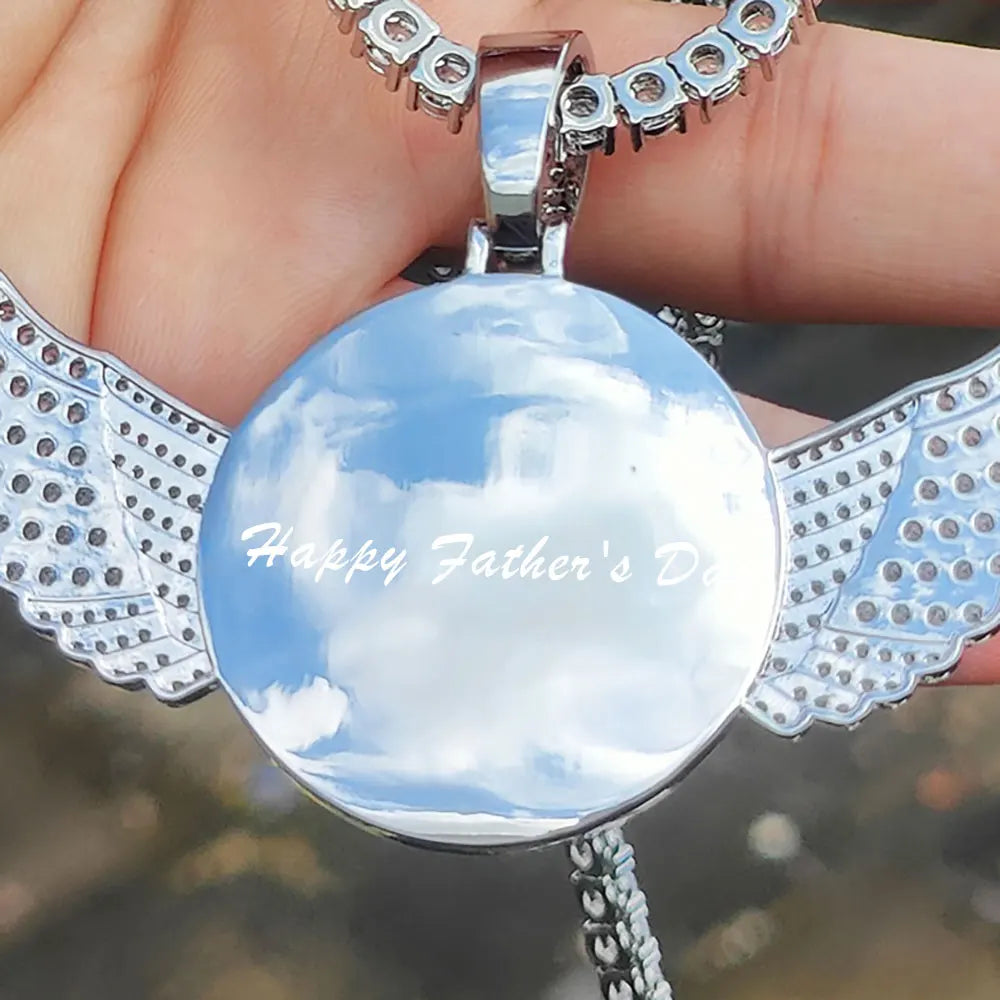 Custom angel wing round photo necklace with personalized pendant and tennis chain, featuring a custom picture and elegant jewelry design.