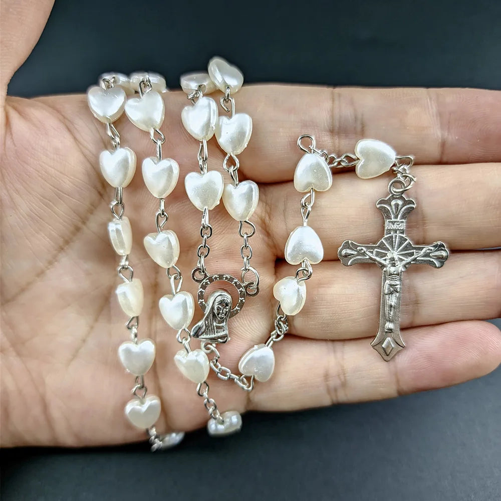 Pink heart Christian rosary beads necklace for women with Virgin Mary and INRI cross pendant, featuring a delicate chain for prayer or fashion.