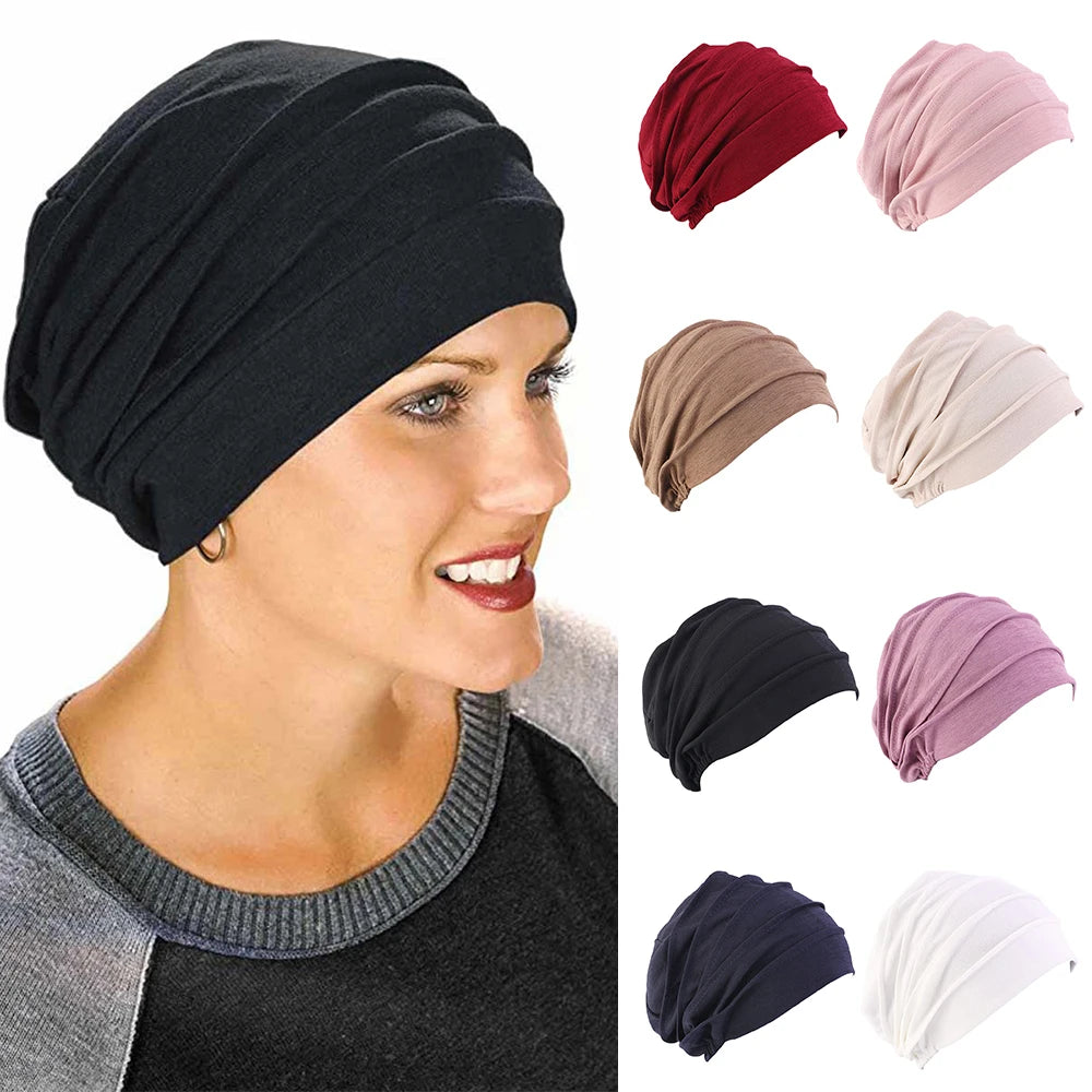 Women’s solid color turban cancer beanie by Showlu Fashion Store, elastic head cap for hair loss, chemo, or hijab wear.