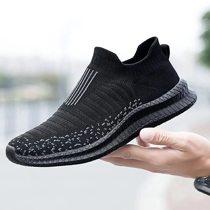 SHOWLU Men's breathable mesh slip-on walking shoes with cushioned soles and stylish design for running and casual wear.