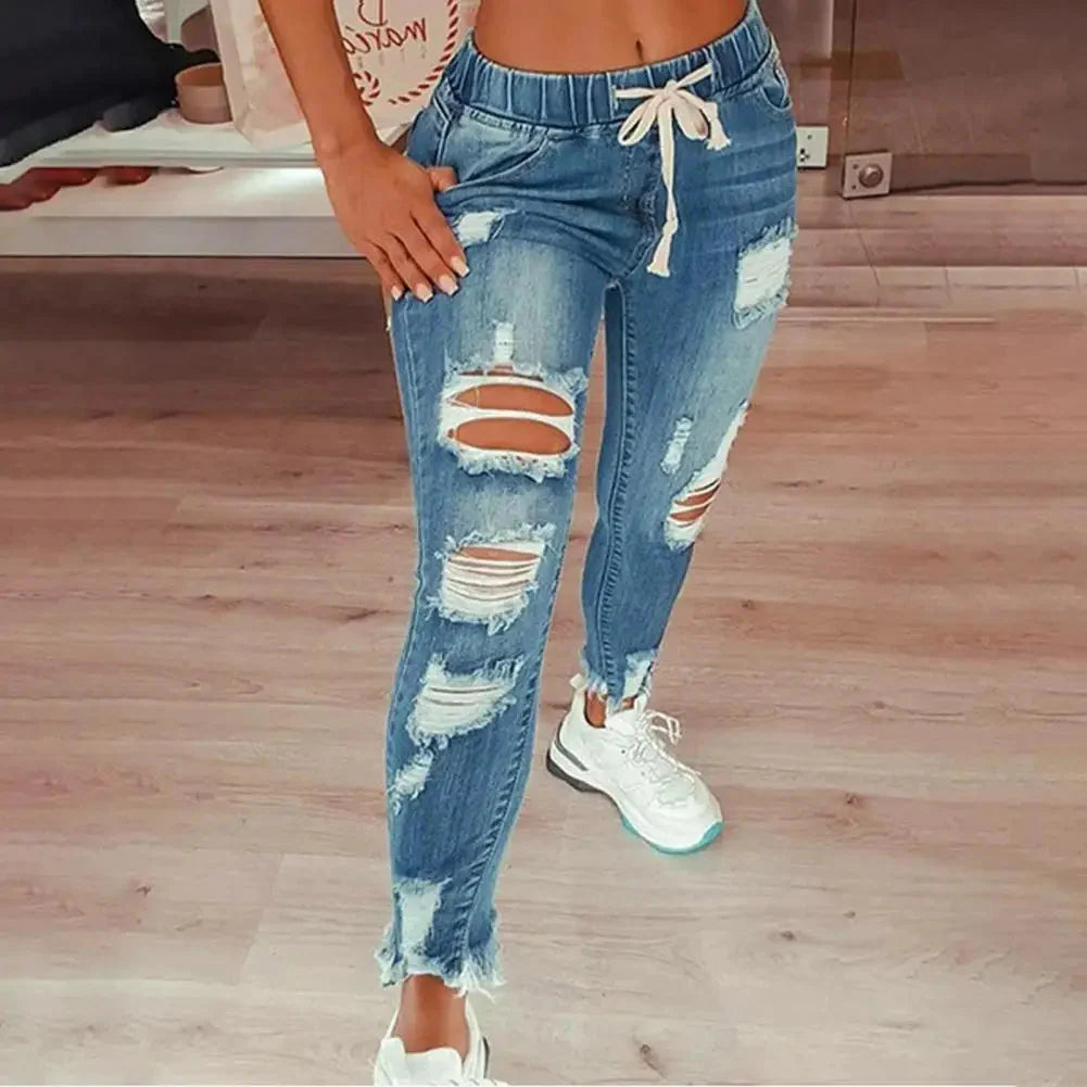 Sanwood Women's ripped hole high waist stretchy skinny denim jeans with a fitted style and distressed details.
